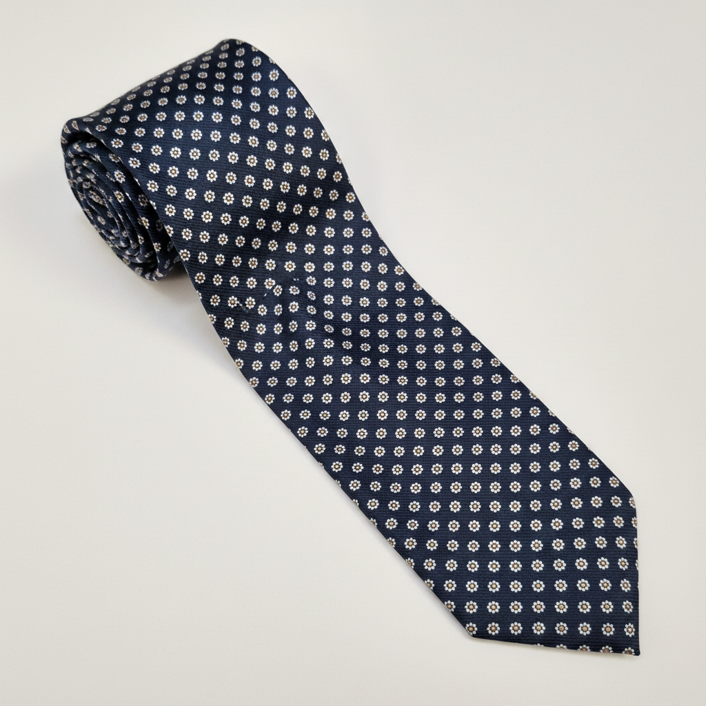 The Milano Tie - silk tie laid flat on light grey background