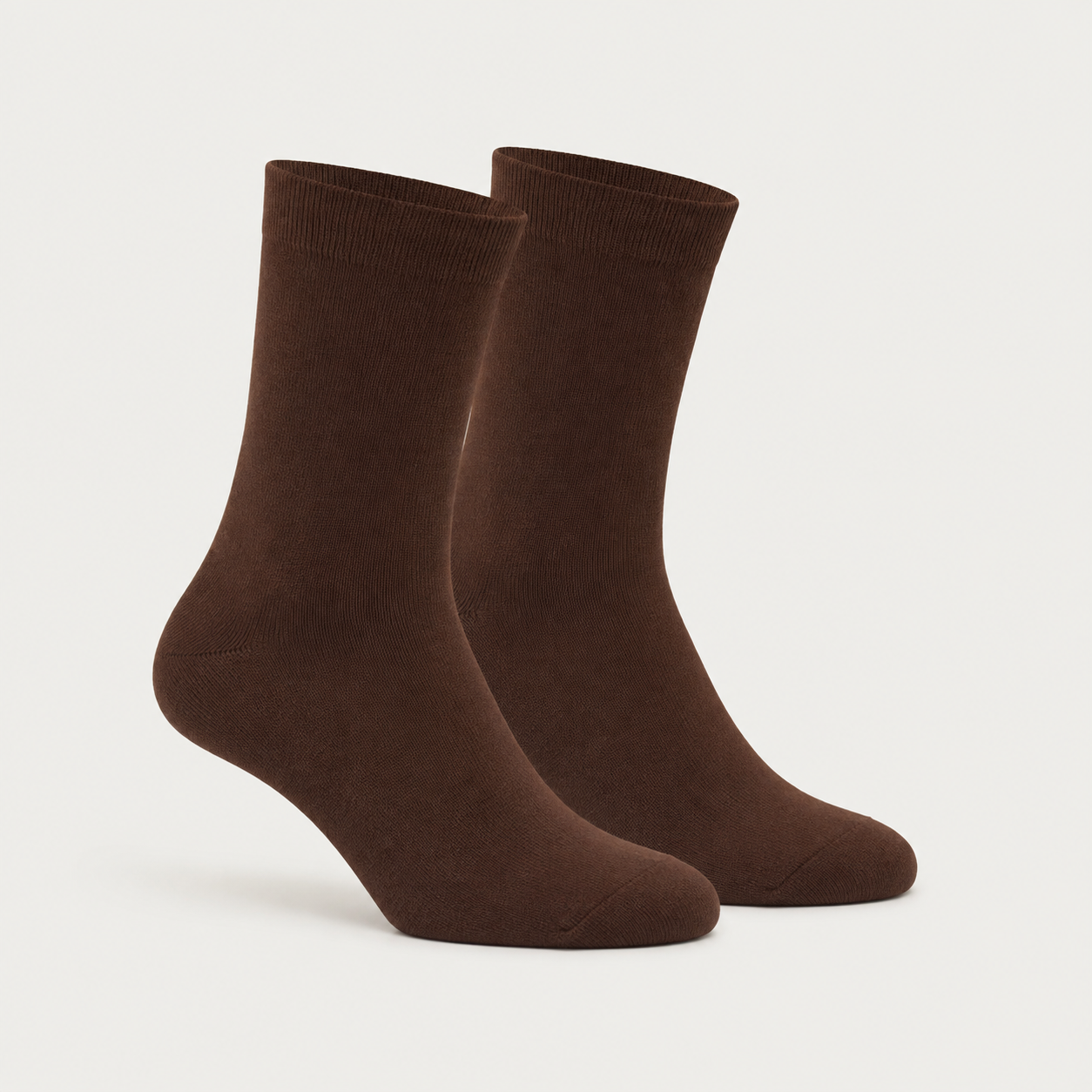 Brown dress socks by URBBANA on a light grey studio background