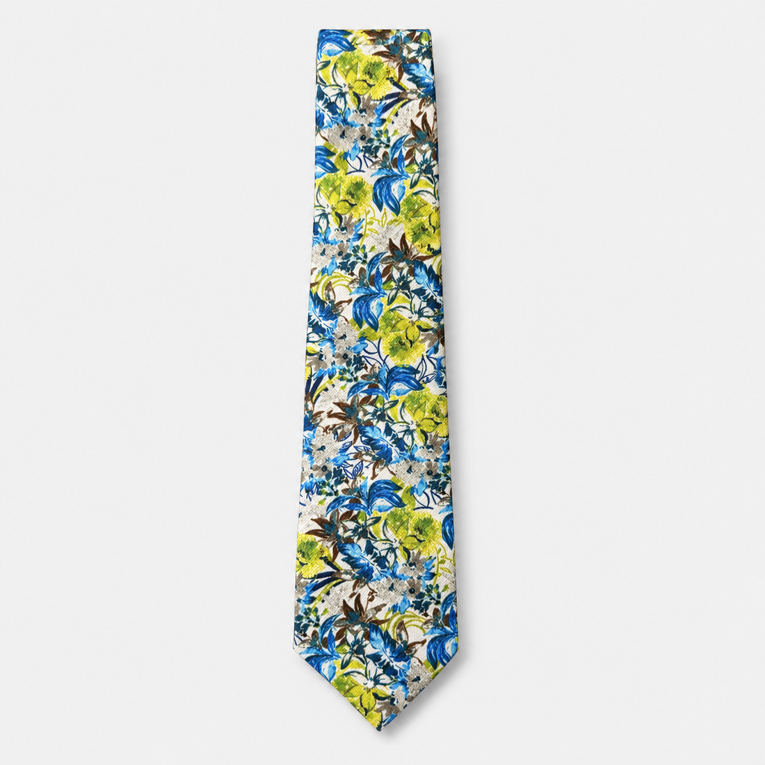 The Perugia Tie, an ivory silk tie with bright blue, lime green and brown botanical motifs on a light grey background.