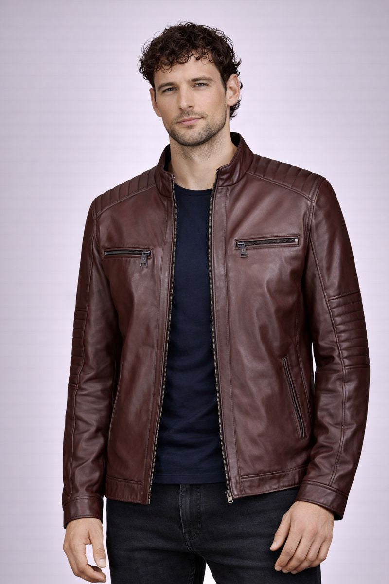 Man wearing a brown leather jacket on a light gray background