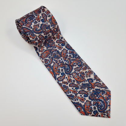 The Firenze Tie - silk tie laid flat on light grey background