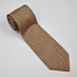 The Napoli Tie - silk tie laid flat on light grey background