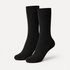 Black dress socks by URBBANA on a light grey studio background
