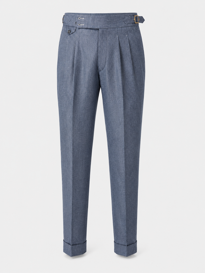 Byron denim-blue pleated trousers with side adjusters and cuffed hems.