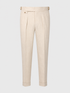 Byron sand pleated trousers with side adjusters and cuffed hems.