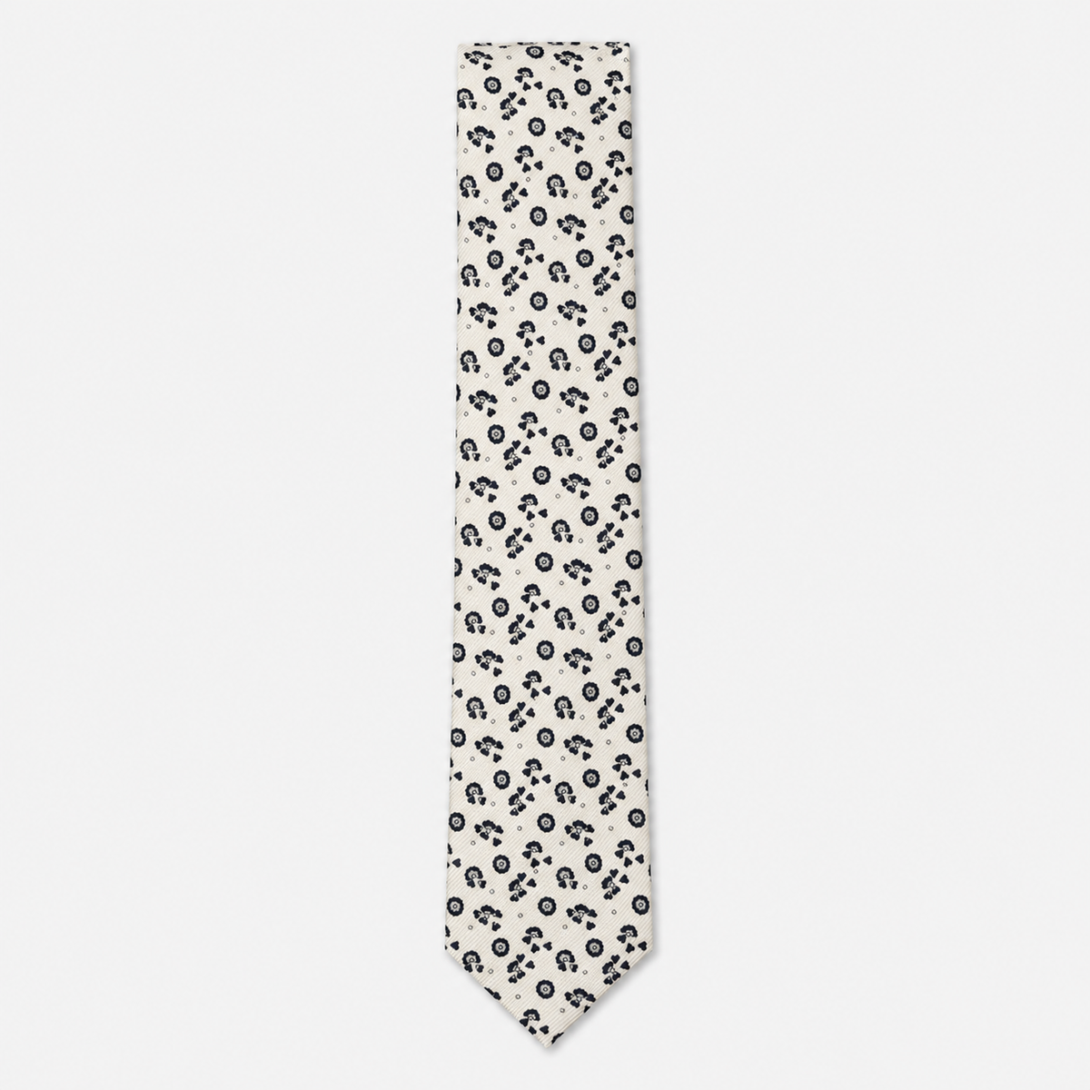 The Foggia Tie – ivory and black floral paisley silk tie on a light grey background