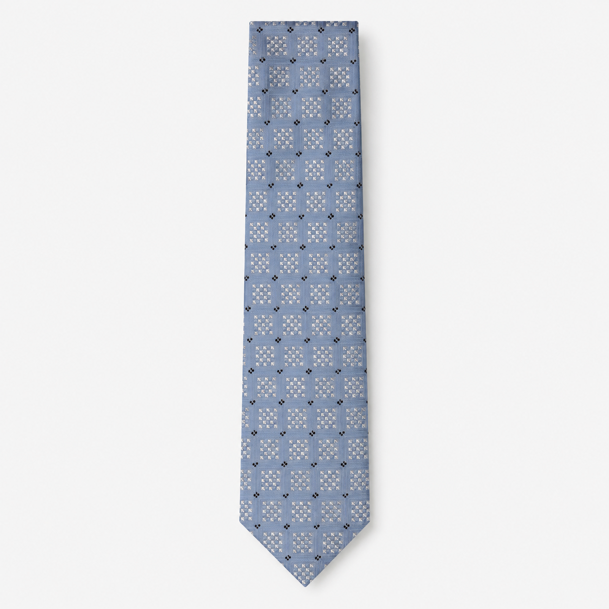 The Positano Tie, a light blue silk tie with white geometric checks and navy accents on a light grey background.