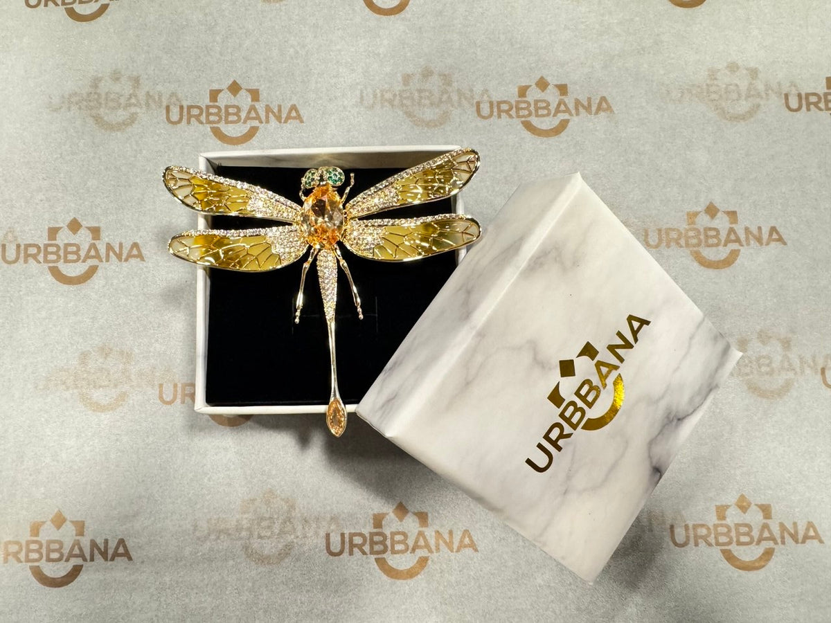 Embellished red dragonfly lapel pin.